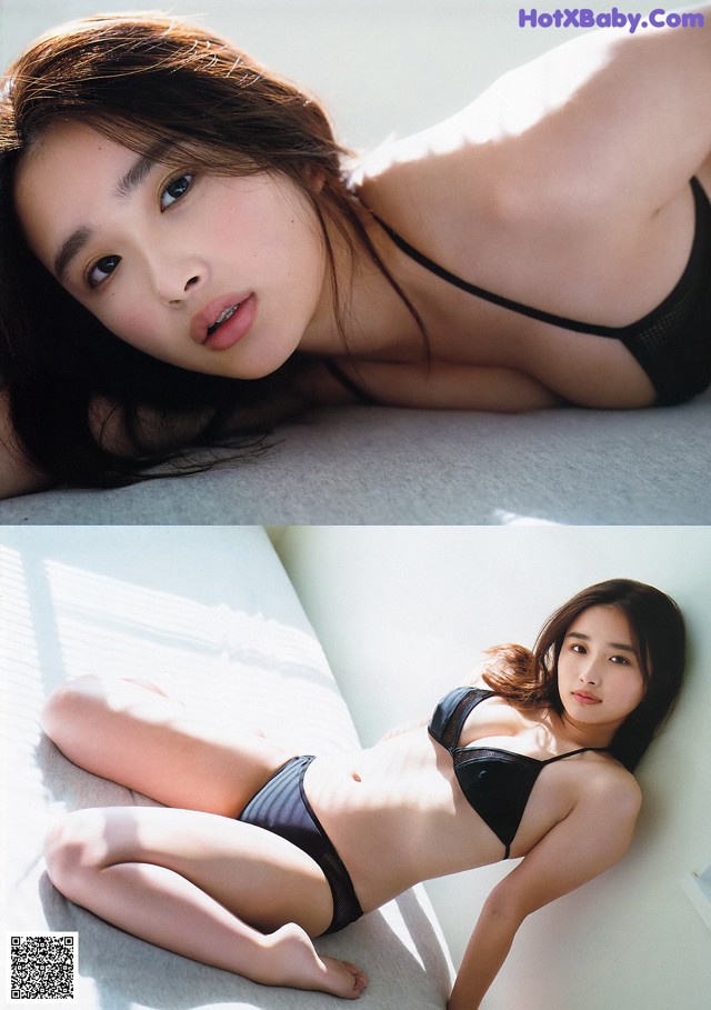 A woman in a black bikini laying on a bed.